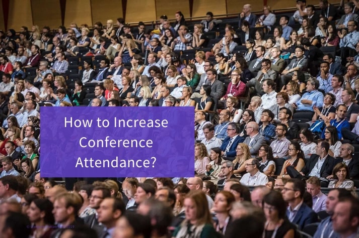 Image showing a large group of people within a confrence hall, for blog article how Increase Conference Attendance
